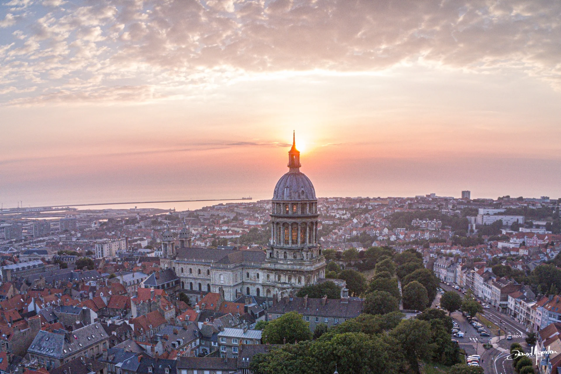Aerial view of Notre-Dame basilica in Boulogne-sur-Mer at sunset, by David Aguilar